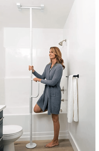 A woman showing how to hold a Floor to Ceiling Grab Bar