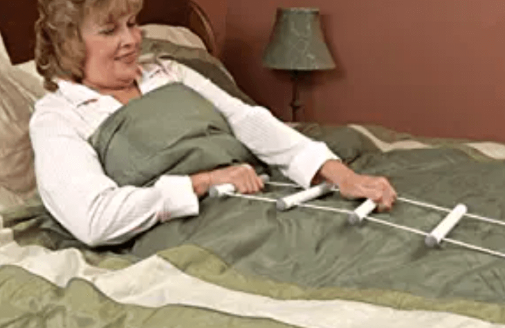 a senior pulling up a rope ladder to stand up from bed